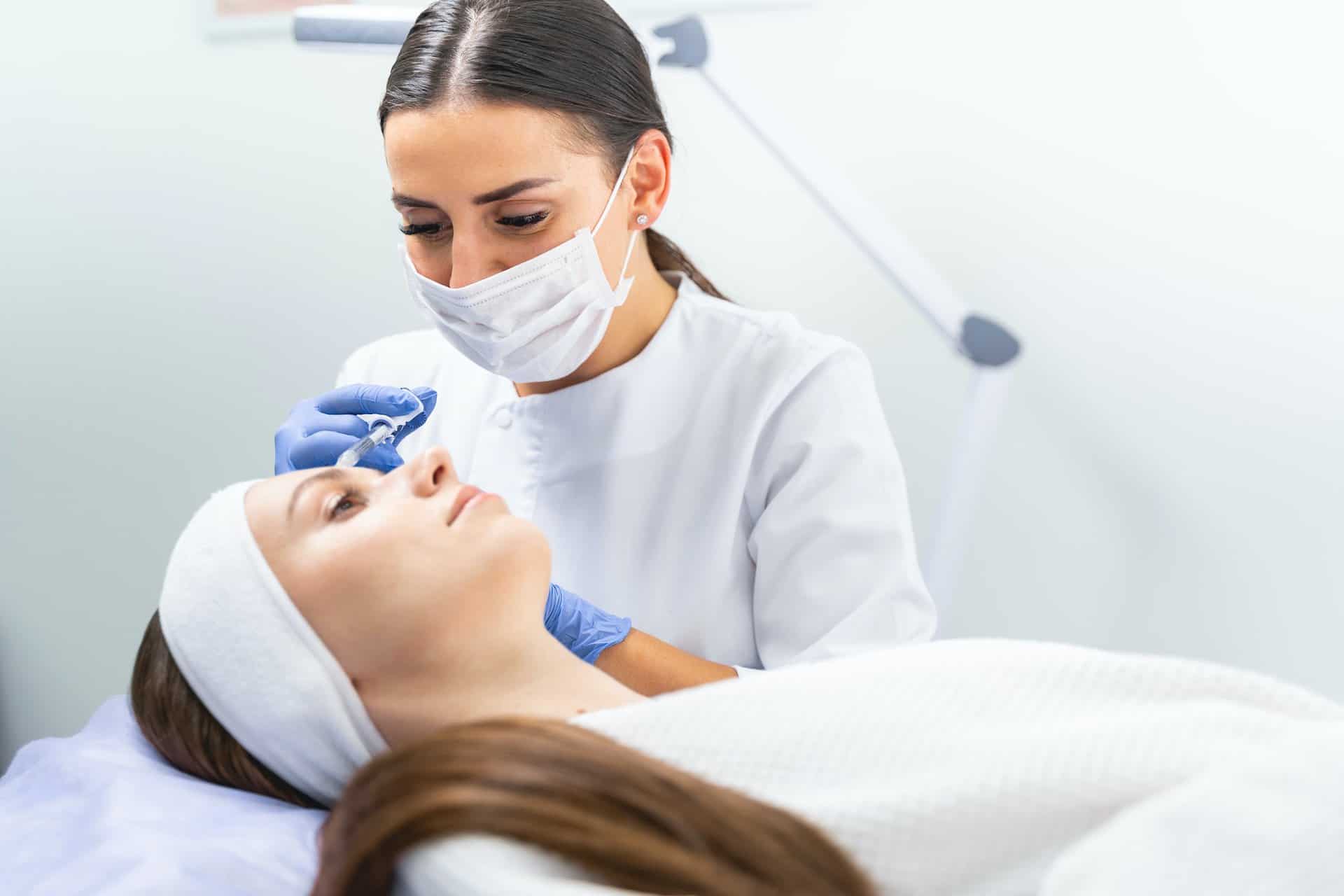 Dermal filler being injected into a patient forehead