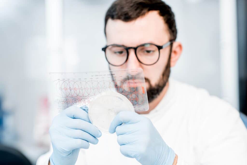 Laboratory assistant working with bacteria
