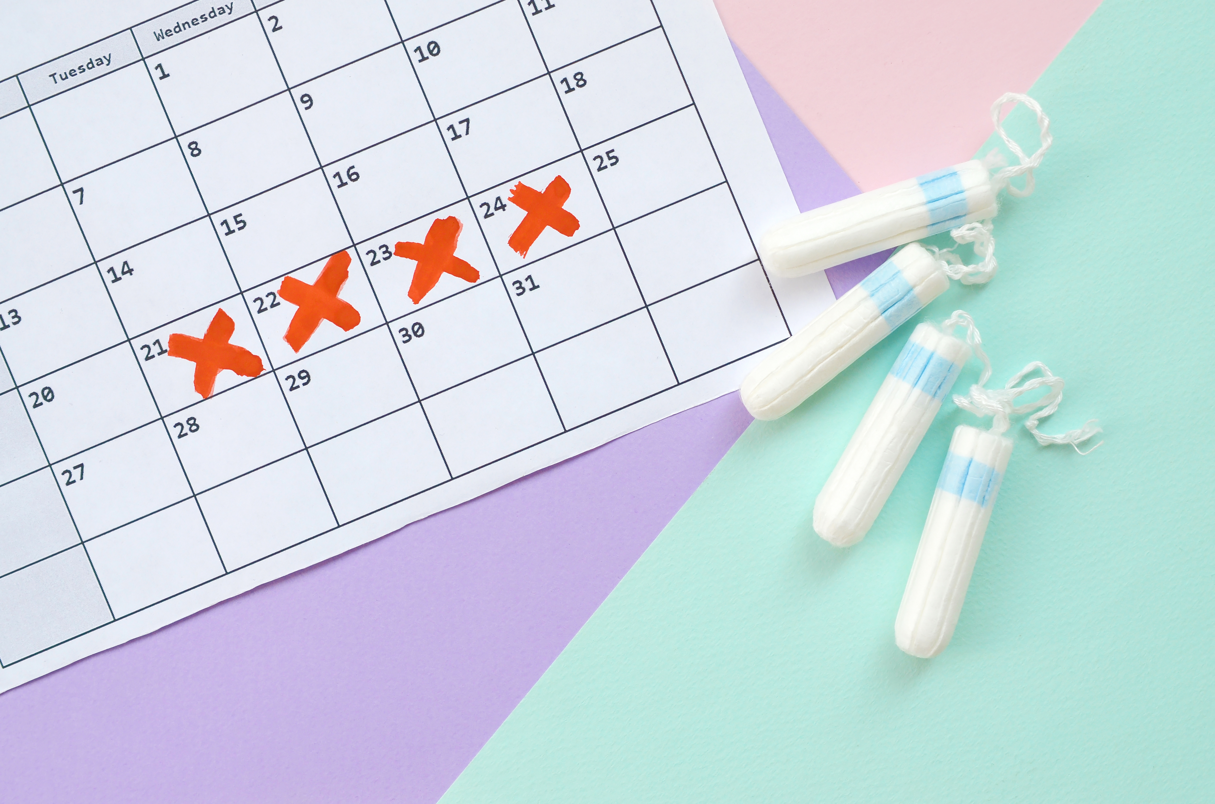 Flat lay composition with calendar and menstrual