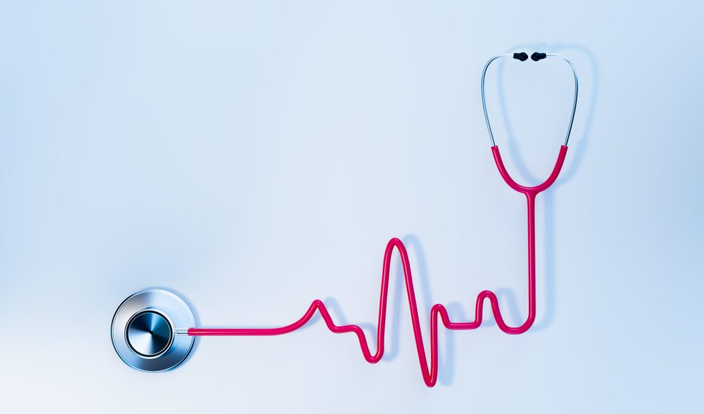 pink EKG graph shape stethoscope on white background